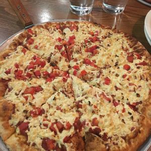 Build your own vegan pizza with daiya cheese, fresh tomatoes, and garlic. at Pizza Luce in Duluth