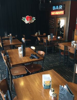 Dining area with the closed stage in the background. at Pizza Luce in Duluth