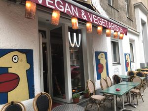 W- Der Imbiss outside view with the paintings on the wall from the famous artist Thierry Noir who painted on the Berlin Wall:-) at W Der Imbiss - Nollendorfplatz in Berlin