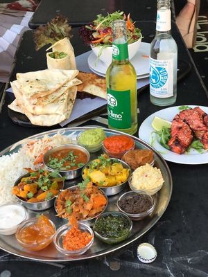 Tasty platter with grilled salmon. The salmon was optional as my girlfriend likes fish! The tasty platter was surprisingly  amazing, a bit adventurous of the combination of sauces but i loved it ! at W Der Imbiss - Nollendorfplatz in Berlin