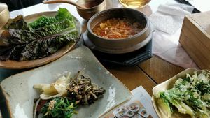 Fermented soybean stew (doenjang jjigae) with fried vegetables, rice and side dishes at Ssukbujaeng-i 쑥부쟁이 in Gyeongju