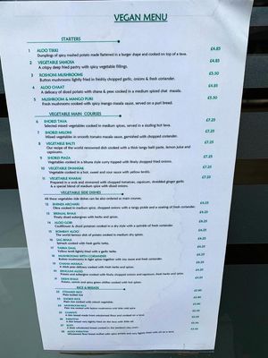 New vegan menu advertised in window 💚 at Cumin Club in Rochester