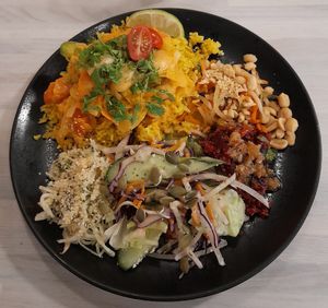 Panang Thai curry, Vietnamese Som Tam salad, beetroot quinoa, apple coleslaw. at Anne's Vege in Espoo