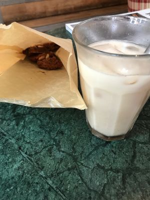 Vegan peanuts and chocolate cookie and an iced chai latte at TICH Healthy Living in Brussels
