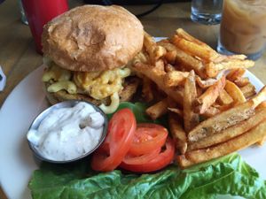 Veggie burger topped with mac n cheez, spicy fries on side.   at Vertical Diner in Salt Lake City