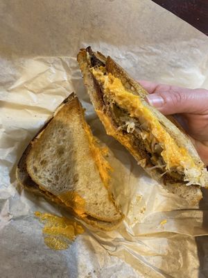 Reuben; Toasted rye topped with corned seitan, sauerkraut, 1000 island dressing, and provolone cheese  at LUHV Vegan Deli in Philadelphia