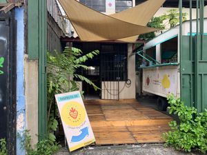 Entrance to food truck and sitting area.  at El Veggie SV - Food Truck in San Salvador