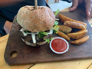 Portobello mushroom burger and fries. at El Veggie SV - Food Truck in San Salvador