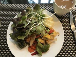Breakfast buffet: fried rice, tofu and veggies, salad, pineapple, coffee...  at Moreganic Restaurant at Away Chiang Mai Thapae Vegan Retreat in Chiang Mai