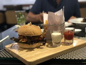 Mon Jam Burger- *Ordered without cheese to make it vegan. *The white sauce is vegan. Fried mushrooms with the normal burger veggies in. Very tasty wish it came with a sauce. Good. at Moreganic Restaurant at Away Chiang Mai Thapae Vegan Retreat in Chiang Mai