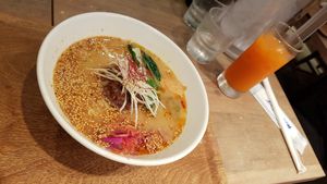 Gold sesame ramen with vege drink. at T's Tantan - JR Ueno in Tokyo