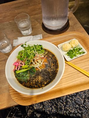 Black sesame noodles with extra cheese balls at T's Tantan - JR Ueno in Tokyo