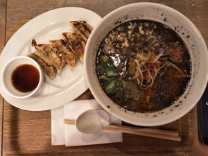 Black sesame ramen with gyoza. at T's Tantan - JR Ueno in Tokyo