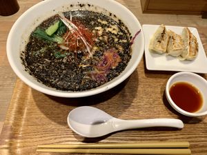 Black sesame ramen with gyoza at T's Tantan - JR Ueno in Tokyo