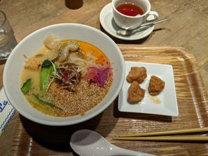 Golden sesame ramen with soy meat and tea at T's Tantan - JR Ueno in Tokyo