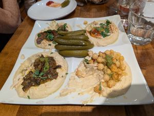 Hummus sampler with pickles at Hummus Place - Upper West Side in New York City
