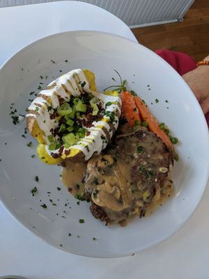 Loaded potato with Salbury steak, $19.. its ok at Mythology in Toronto