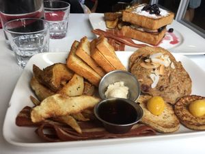 Doug's slam platter (forefront, $17) - Stuffed french toast (back, $16) at Mythology in Toronto