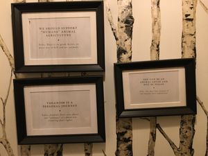 Vegan messages on the walls and above the toilet :) at Mythology in Toronto