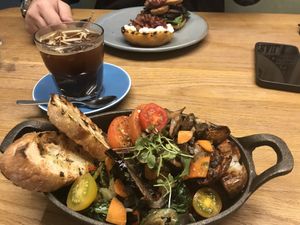 Brunch skillet made vegan, iced americano, vegan butty in the background #Veganuary at Yonder in Queenstown