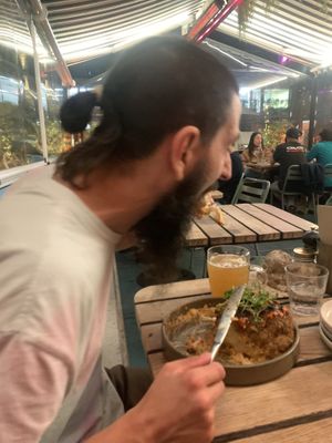 Matt eating his second cauliflower head  at Yonder in Queenstown