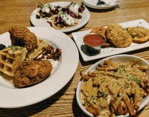 chicken and waffles, poutine, pizza rolls, and mushroom tacos at City O' City in Denver