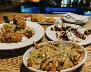 chicken and waffles, poutine, pizza rolls, and mushroom tacos at City O' City in Denver