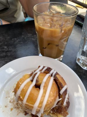Cinnamon roll (started eating before the picture) and iced espresso with oat milk and vanilla  at City O' City in Denver