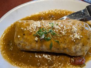 Vegan breakfast burrito w/ green chili sauce. at City O' City in Denver