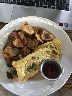 Vegan Omelette (Just Egg substitute) with roasted poblanos, shiitake ”bacon” and a side of seasoned potatoes. at City O' City in Denver