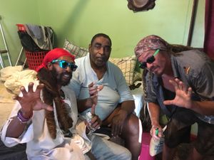 Got Tion, a man missing a leg... a new wheelchair and walker for transition into it at Ini Ital Rastarant in Negril