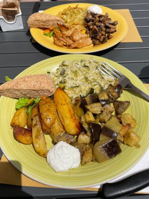 Far: soy protein, cabbage, mushrooms. Near: potatoes, eggplant, rice.
Each lunch portion includes one main dish and two sides. Both served with savory cream sauce and bread. at L'Orto Bistrot in Turin