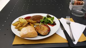 Homemade! Eggplant burger, eggplant with rice cream (amazing), potatoes, ketchup VEGAN at L'Orto Bistrot in Turin