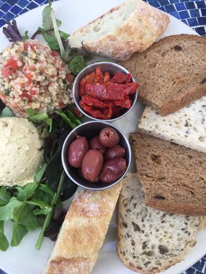 Hummus Plate with Tabouli, Olives and Sun Dried Tomatoes. Perfection! at Blue Dahlia Bistro in San Marcos