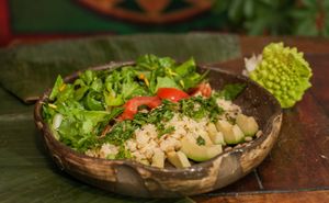 Green salad with couscous, avocado, tomatoes and pine tree nuts. at Agharti in Odessa