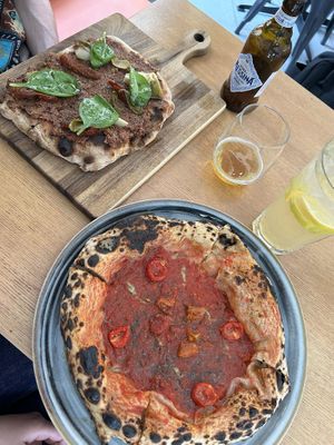 Pinsa Tapenade and Pizza Marinara di Vegazzi at Vegazzi Specialty Pizzeria in Budapest