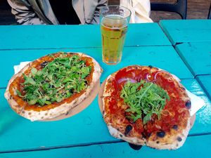 September' zucchini pizza special (left) and the Hungarian style pizza (right). at Vegazzi Specialty Pizzeria in Budapest