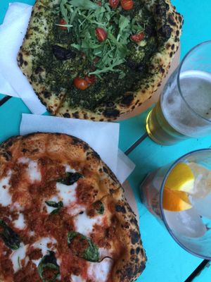Pesto pizza and cheese pizza at Vegazzi Specialty Pizzeria in Budapest
