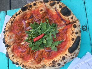 Sausage, red onion and chilli pizza  at Vegazzi Specialty Pizzeria in Budapest