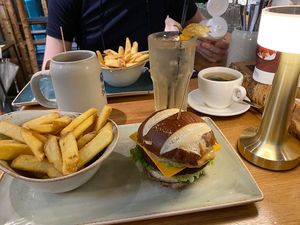 Avocado vegan burger - see that chez slice? It’s so so cheezy.  Pretzel bun.  at Hans im Glück in Central Singapore