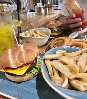 Can’t remember what’s this burger but it’s one of 10 vegan burgers they offer on the menu. Also, onion rings! at Hans im Glück in Central Singapore