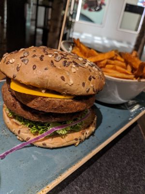 Vegan burger with an add-on of a patty and vegan cheese at Hans im Glück in Central Singapore