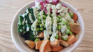 Forbidden rice, sweet potatoes, edamame, carrots, mushrooms, pickled onions, steamed kale, and cashew lime crema  at Honest Mary's in Austin