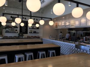 Counter service, four types of seating options. Here is the communal bar seating  at Honest Mary's in Austin