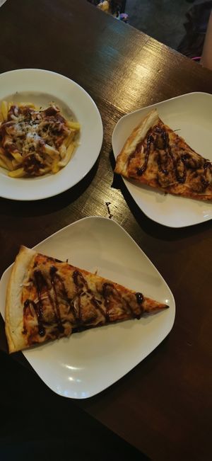 Pizza and poutine at Slices in Osaka