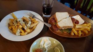 The poutine was great and fake chiken amazing!  Ah, and the Kina is super friendly. at Slices in Osaka