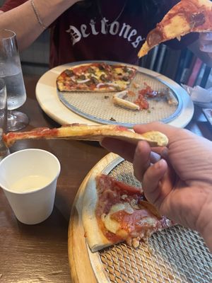 cracker crust - we thought they were store bought crusts but did catch a glimpse of them being made by handd  at Slices in Osaka