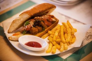 They ran out of the steak for the Steak Sandwich so the staff offered to put vegan bites in this roll with in house made BBQ sauce! at Slices in Osaka