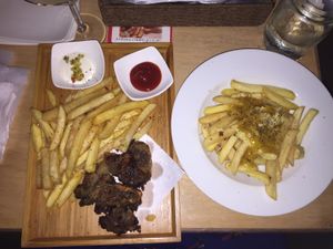 Vegan fish and chips and vegan poutine  at Slices in Osaka