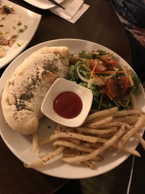 Vegan calzone with fries and salad at Slices in Osaka